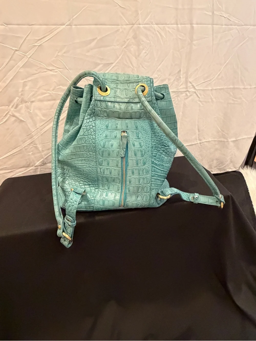 Brahmin Turquoise  very good condition sling backpack. Faux Alligator.